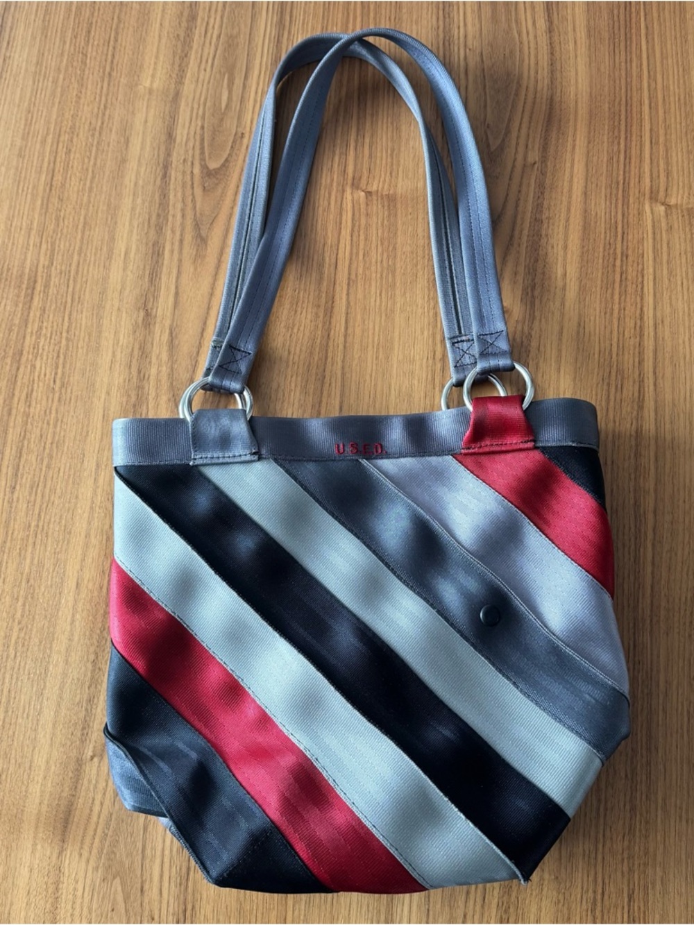 U.S.E.D. Recycled Seatbelt snap closure tote bag